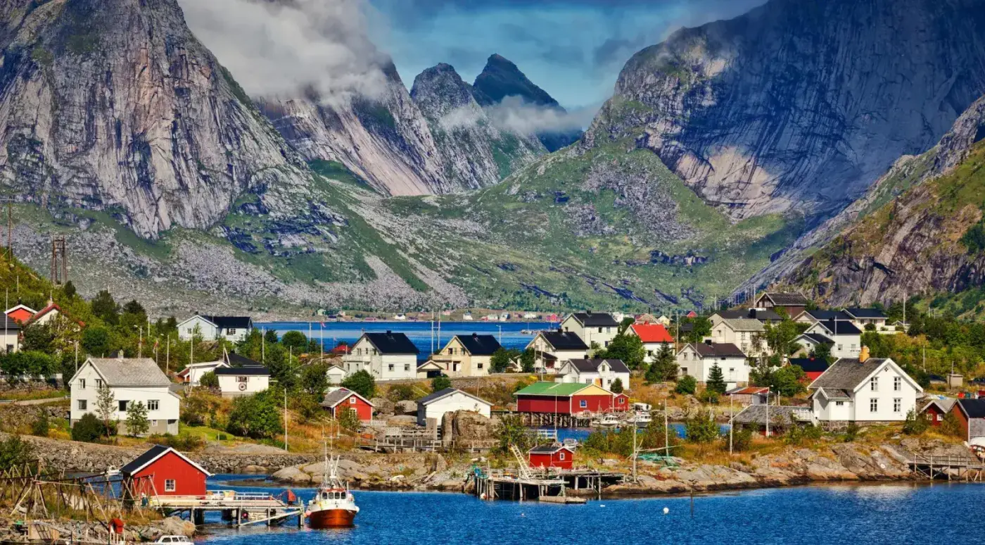 Colourful harbour houses and green peaks in a classic Lofoten fishing village